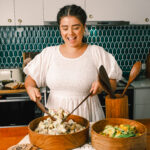 Handcrafted solid Brigalow salad servers, made from Australian timber and designed to rest securely on the bowl edge after serving, adding a functional and stylish touch to your kitchen.