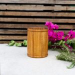 Handcrafted NG Rosewood utensil holder made from a single piece of solid timber, designed to neatly organize kitchen utensils and add natural warmth to your kitchen.